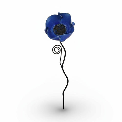 A single blue flower-shaped ornament with a black metal stem and spiral design.